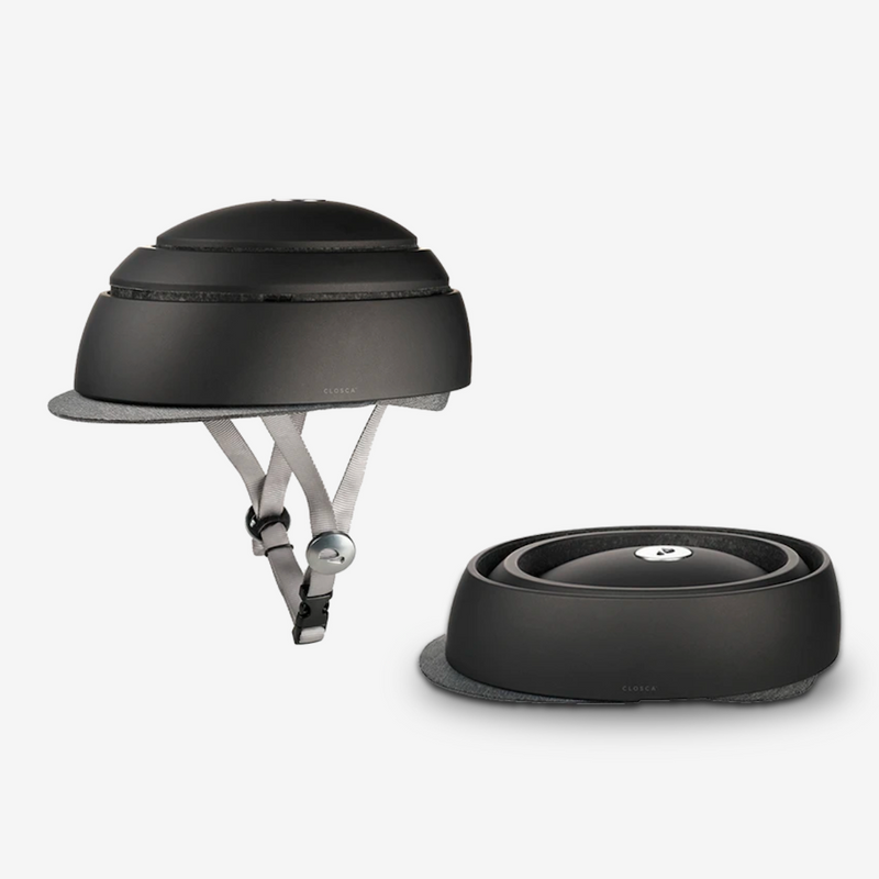 Casque urbain pliant Closca noir avec visiére. Puce NFC intégré au casque pour fiche médical et les contacts en cas d'urgence. Casque de vélo de ville pour homme, casque de trottinette pour homme chez Robin concept store homme, Boutique en ligne de cadeau homme. Annecy