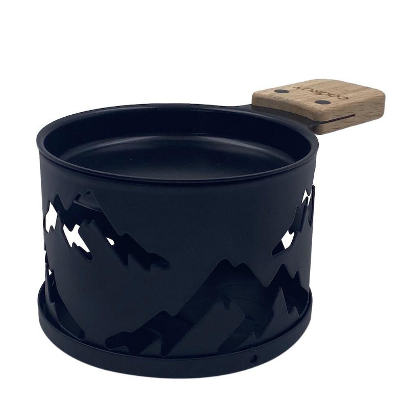 Raclette à la bougie avec montagnes decoupé dans le métal pour décoration. Raclette Cookut sur Robin concept store Annecy.